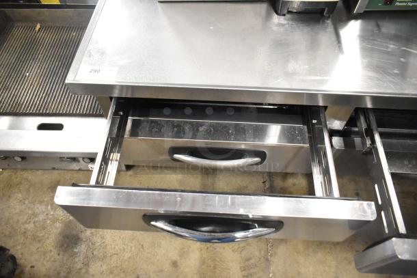 Stainless steel commercial 4-drawer chef base on casters, shown with open drawers. 115 Volts, 1 Phase. Item label: 290.