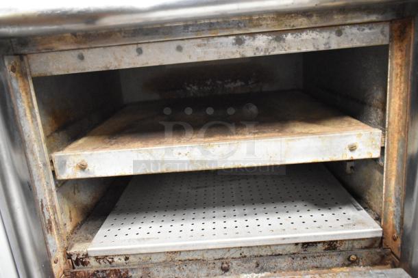 Bakers Pride DPOC-S stainless steel pizza oven, electric, 208 volts, 1 phase. Interior shows signs of use.