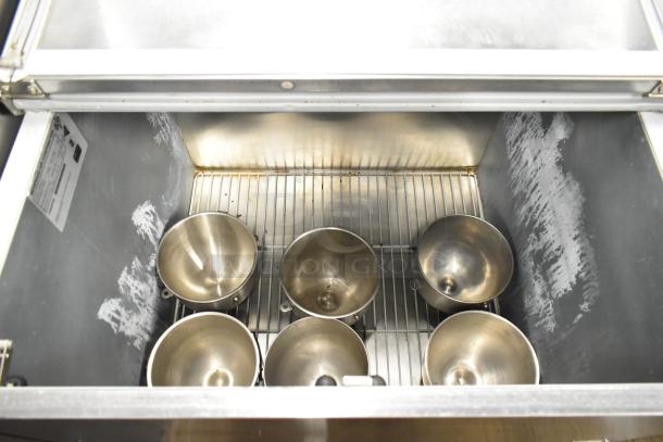 Beverage Air SM34N-W metal commercial milk cooler, 115V, used condition, visible interior with metal bowls and wiring.