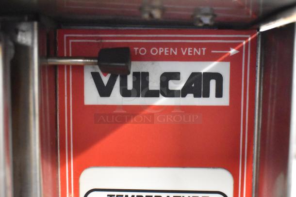 Red Vulcan label with "To Open Vent" instructions, visible on Vulcan ECO4C stainless steel commercial convection oven.
