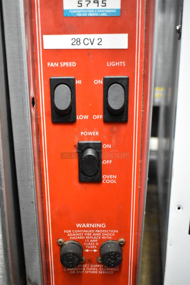 Controls for Vulcan ECO4C Stainless Steel Commercial Convection Oven, featuring fan speed, light, and power settings. Warning label included.
