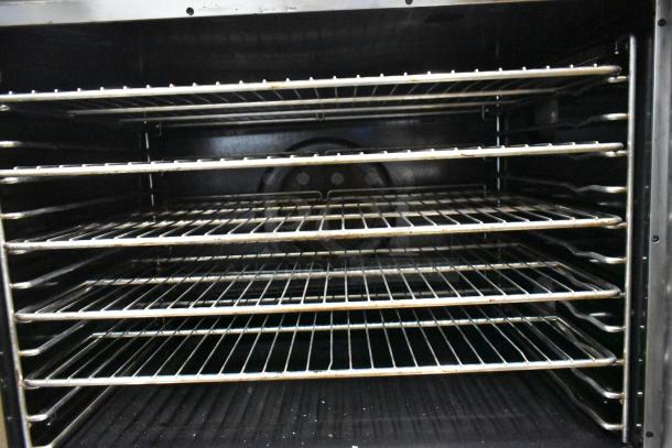 Vulcan ECO4C stainless steel commercial convection oven, 480V, 3-phase, five metal racks, view-through doors, excellent condition.