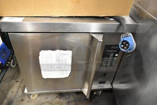 Garland Stainless Steel Commercial Electric Powered Half Size Convection Oven w/ Solid Door and Metal Oven Racks on Commercial Casters. - Item #1226953