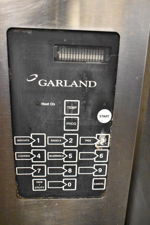 Garland stainless steel commercial electric convection oven control panel with various cooking settings and start button.