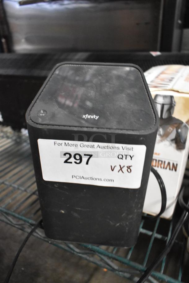 Auction lot with Xfinity router, Mandalorian mug, size 8 Jordan sneakers, BB gun BBs, Batman DVD, XG2v2-P box. Lot 297.