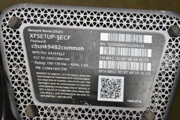 Xfinity router label showing SSID, password, WPS Pin, FCC ID, power rating, serial number, and MAC addresses.