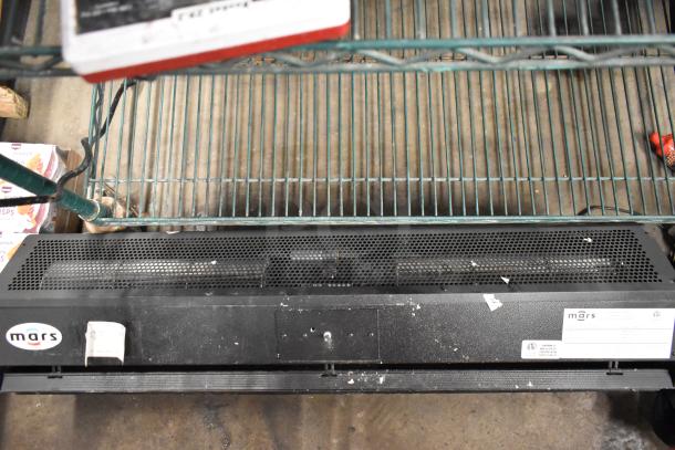 Mars LPV236-1UA-OB black metal air curtain, visible wear, 115 volts, 1 phase, model and branding labels present.