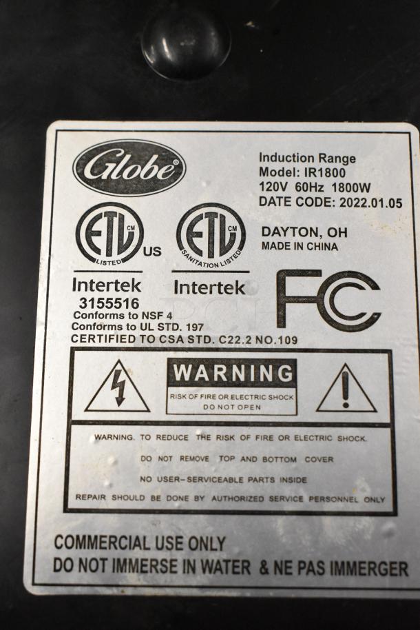 2022 Globe IR1800 single burner induction range label, 120V, 1800W. ETL listed, commercial use, safety and usage warnings included.