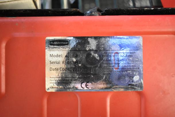 Rubbermaid 4010-88 scale, 150 lb capacity, red casing. Label shows model, serial #057454, date code 2215.