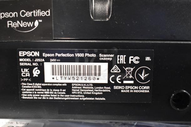 Epson J252A Photo Scanner label showing model, serial number LTYW521260, compliance markings, and made in Indonesia.