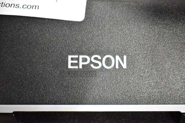 Epson J252A Photo Scanner, featuring a textured black surface with white "EPSON" branding. Used condition.