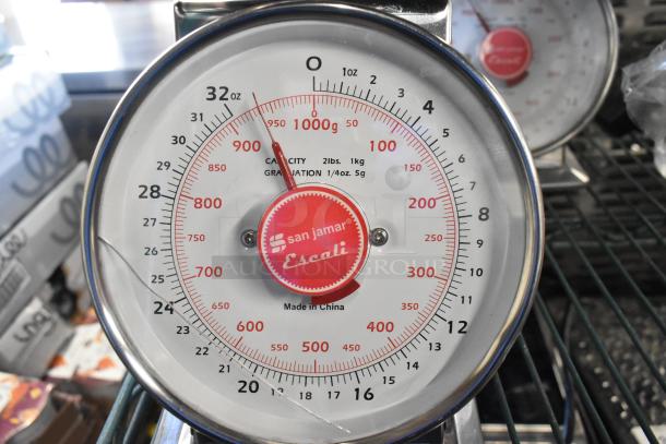 San Jamar Escali metal countertop scale, 32 oz capacity, shows weight in grams and ounces, made in China, red dial.