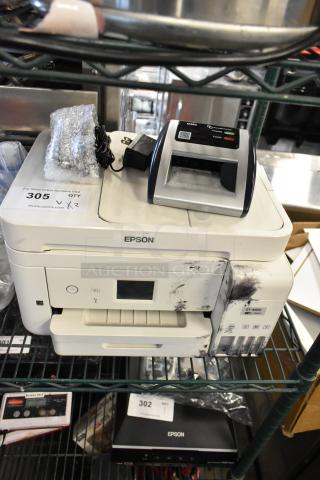 Epson ET-4850 printer and AccuBanker D450 counterfeit bill detector, both showing signs of wear. Auction tag indicates 2 items.