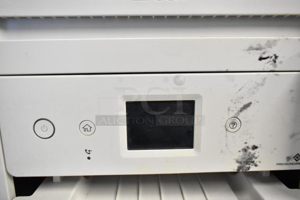 Epson ET-4850 Printer, white, touchscreen, visible smudges, buttons for power, home, and help.