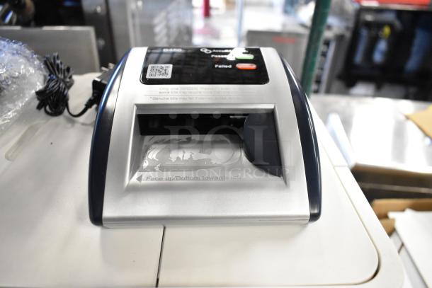 AccuBanker D450 Counterfeit Bill Detector, compact design, clear interface, good condition. Power cord shown.