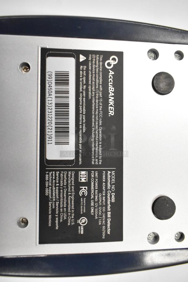 Label of AccuBanker D450 Counterfeit Bill Detector; shows model number, power requirements, and compliance details.