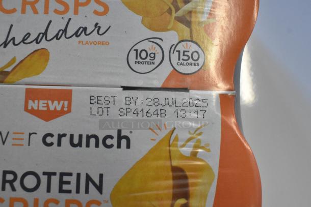 Boxes of Power Crunch Protein Crisps, cheddar flavor, 10g protein, 150 calories. Best by 28 Jul 2025.