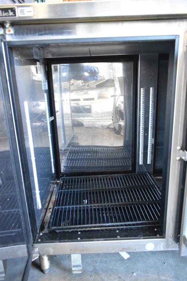 Perlick PTS60-RO-1 stainless steel 2-door back bar cooler. Features adjustable shelves, interior lighting, and commercial-grade build.