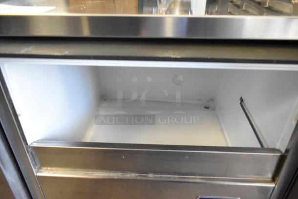Manitowoc RNS0244A stainless steel ice machine, self-contained, 115 volts, 1 phase, commercial use, interior view.