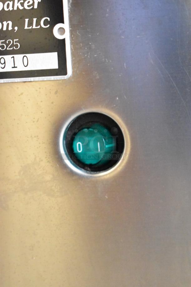 Manitowoc RNS0244A ice machine control with a visible "0" and "1" green switch on stainless steel panel.