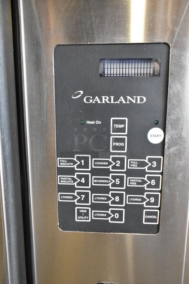 Garland stainless steel commercial half-size convection oven control panel with programmable buttons and indicator lights.