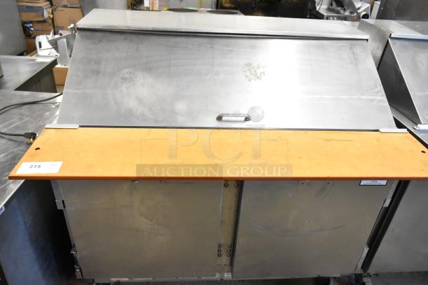 Beverage Air stainless steel commercial prep table in used condition, features bain marie mega top, on commercial casters.