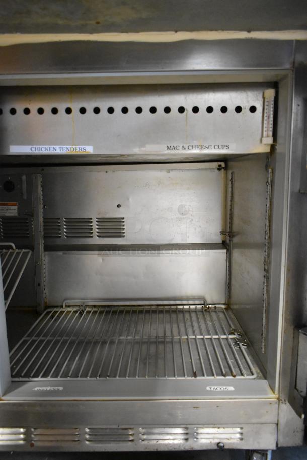 Beverage Air stainless steel commercial sandwich prep table with shelves, visible labels, and commercial casters, 115V, 1 phase.
