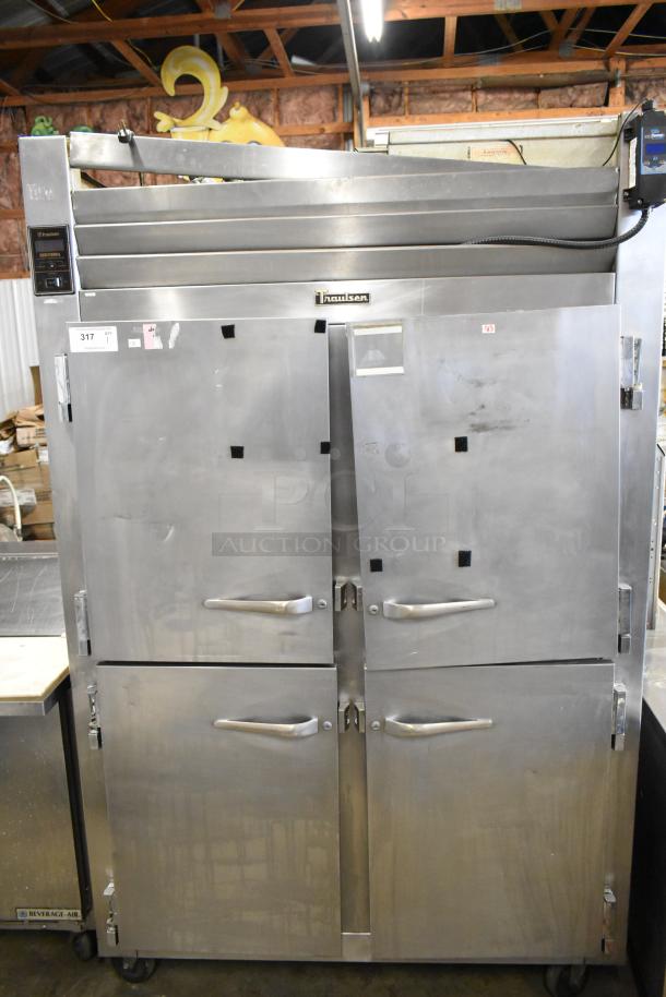 Traulsen RHT 2-32NUT stainless steel commercial reach-in cooler with four half-size doors, 115 volts, 1 phase, good condition.