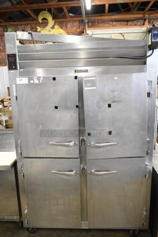 Traulsen RHT 2-32NUT stainless steel commercial reach-in cooler with four half-size doors, 115 volts, 1 phase, good condition.
