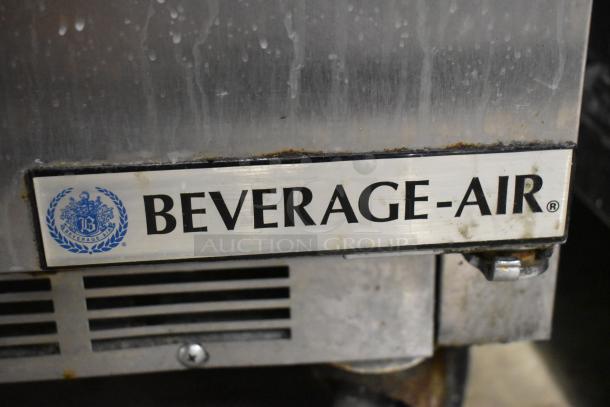 Beverage Air SPE48HC-12C commercial prep table, stainless steel, logo plate detail, mounted on commercial casters.