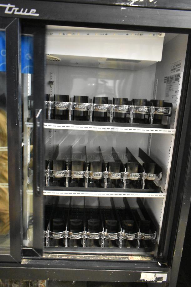 True GDM-41SL-48-HC-LD 2-door reach-in cooler with poly coated racks, metal frame, and visible shelf dividers. 115V, 1 phase.