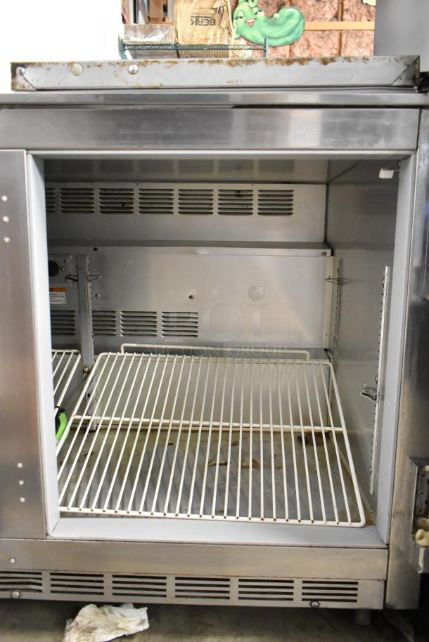 Beverage Air UCR48A stainless steel 2-door undercounter cooler on casters. Includes shelving. 115 volts, 1 phase. Signs of use.