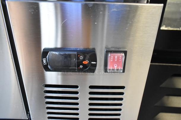 Stainless steel Avantco 178CBE60HC chef base control panel, digital display, and voltage switch, new with minor scratches.