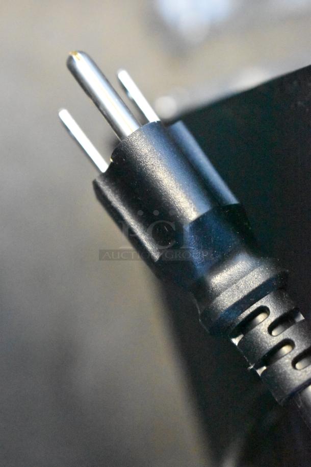Close-up of a power plug from the 2025 Avantco 178CBE60HC stainless steel chef base, 115 volts, 1 phase.