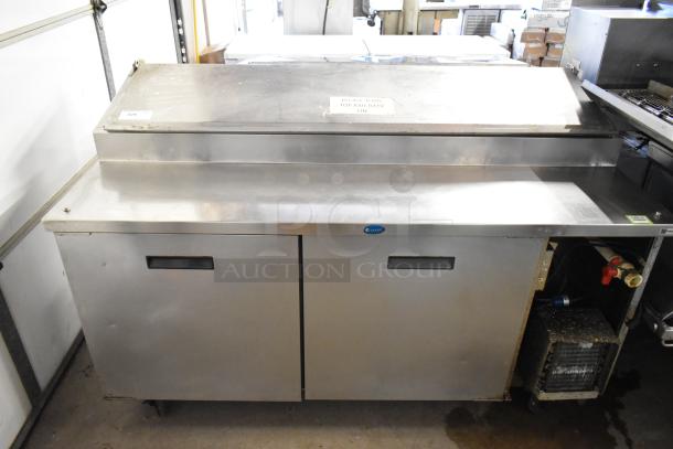 Randell stainless steel commercial pizza prep table, 115 volts, 1 phase, on commercial casters, shown in used condition.