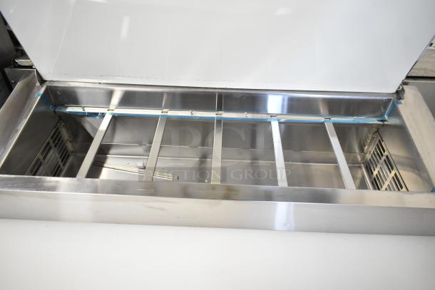 Brand new Avantco 178APPT49HC stainless steel pizza prep table, scratch and dent, commercial casters, 115V, 1 phase.