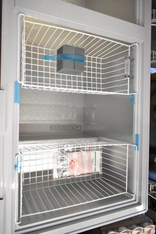 KoolMore SCF-24C metal commercial chest freezer, 24 cu ft., brand new with minor scratches and dents. Includes wire baskets.