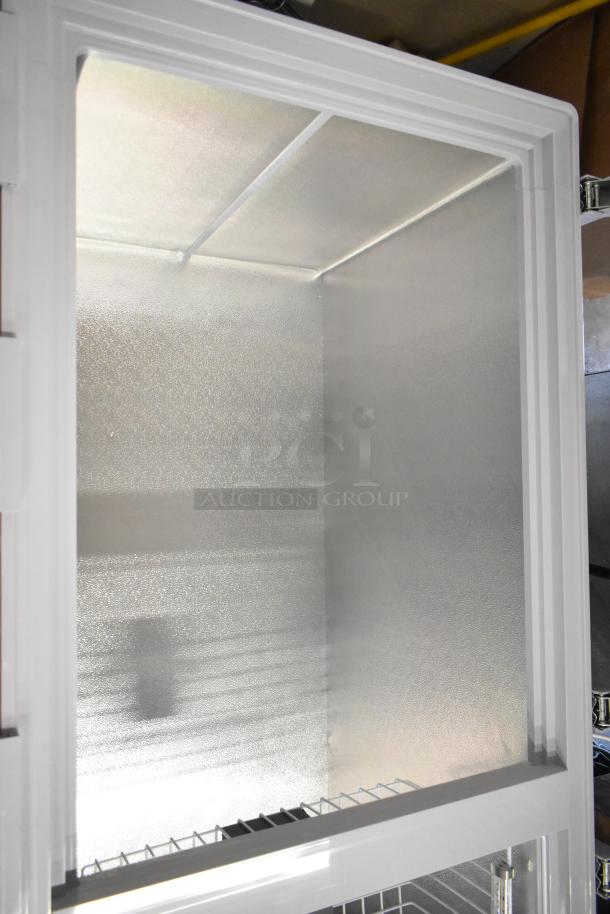 KoolMore SCF-24C metal commercial chest freezer, 24 cu ft, interior view, new with scratches, 115 volts, 1 phase.