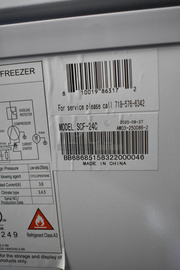 Alt Text: KoolMore SCF-24C commercial chest freezer label, showing model and barcode, 24 cu ft, new scratch and dent condition.