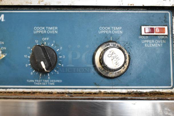 Alto Shaam 1000-TH oven controls showing cook timer and temperature dials, in used condition with visible wear.