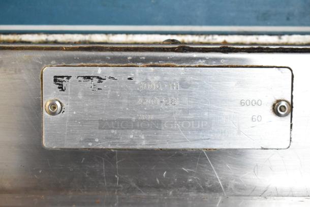 Alto Shaam 1000-TH Halo Heat commercial oven label showing model and voltage details. Stainless steel, used.