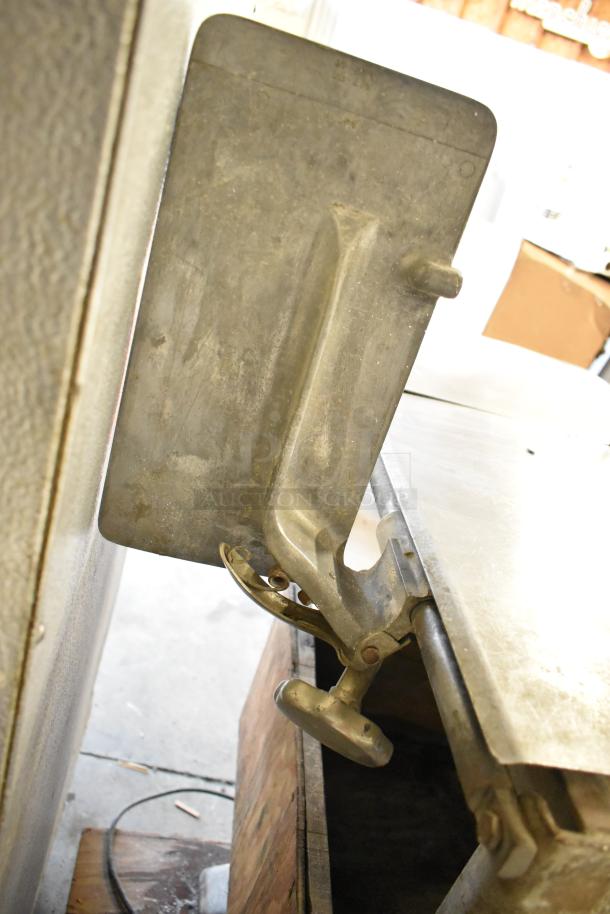 Biro 33 metal commercial meat saw, floor style, showing robust metal construction and an adjustment knob. Used condition.