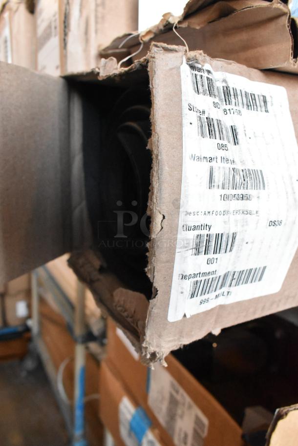 Black anti fatigue mat in original packaging with visible barcode label. Box is slightly worn.