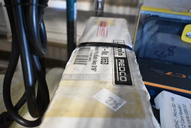 Tier lot featuring bagged tongs, Diversey Stride Citrus Neutral Cleaner, cords, phone cases, and Redco packaging.