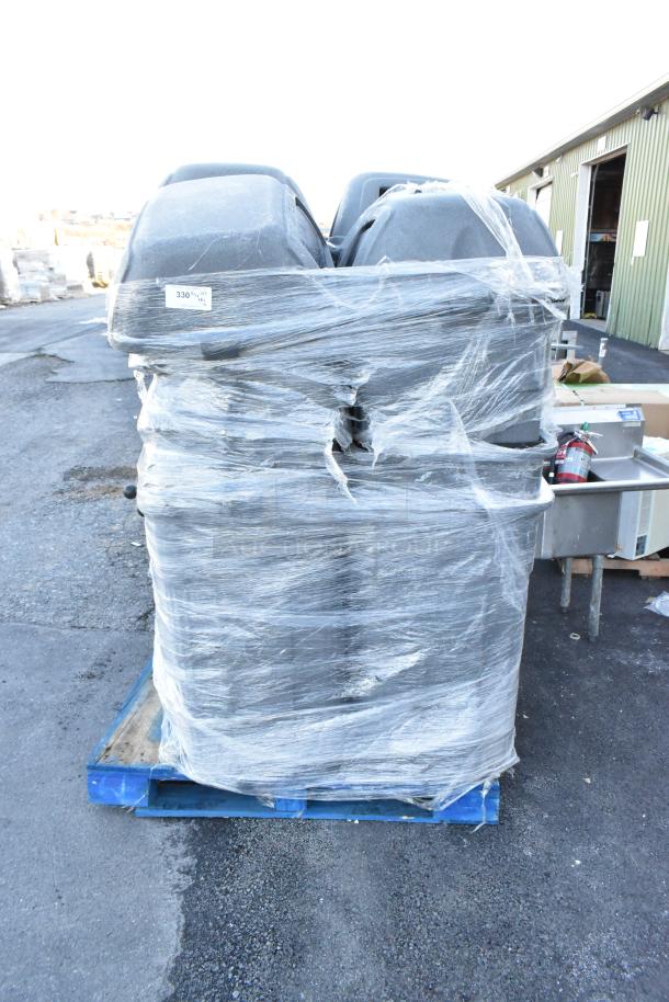 12 gray poly trash cans wrapped in plastic, stacked on a pallet. Good condition. Label indicates lot number 330.