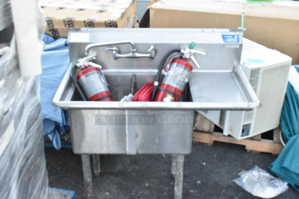 Stainless steel 2-bay sink with right side drain board, includes 2 fire extinguishers, buyer must pick up.