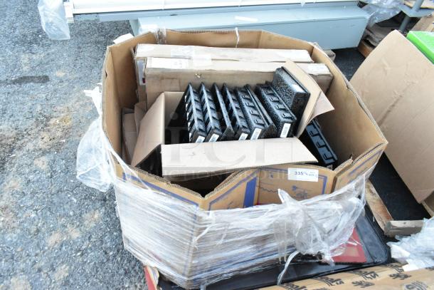 17 assorted items in a large box, including black cash drawer inserts. Condition appears used. Various labels visible.