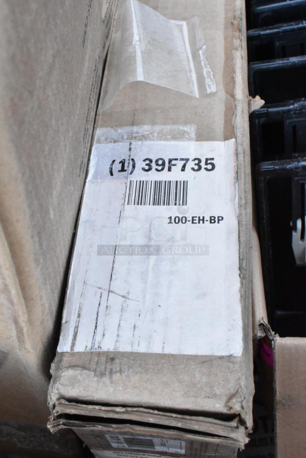 Box of various items including cash drawer inserts with label: "(1) 39F735, 100-EH-BP." Worn packaging indicates used condition.