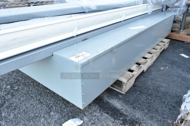 Gray metal unit on a pallet, part of auction lot with 18 items including light fixtures. Tag indicates item 336.