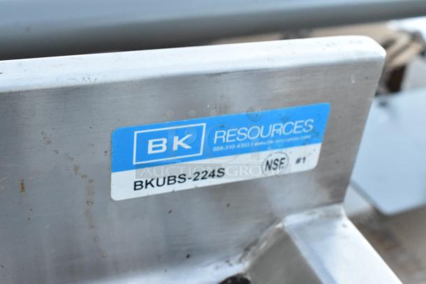 Stainless steel 2 bay sink by BK Resources, model BKUBS-224S. Features faucet, handles, NSF certification, and visible label.